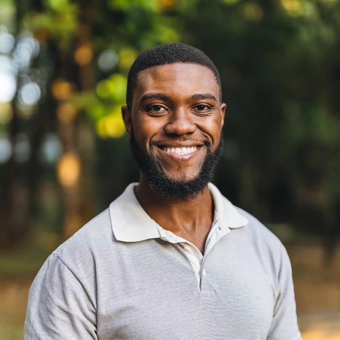 smiling young man in the public park