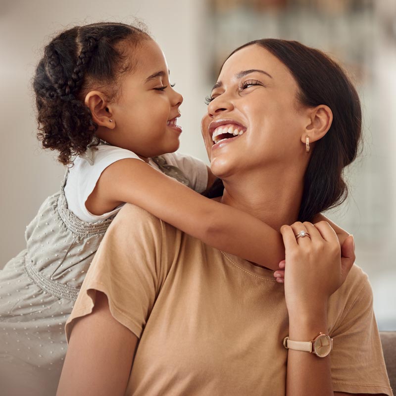 smiling mother and daughter