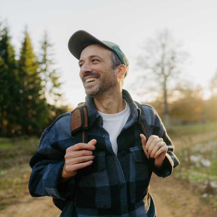 smiling man on hike