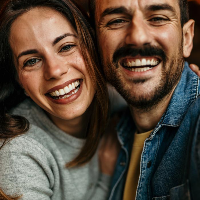 Happy couple smiling and taking a selfie